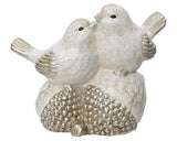 Pair of Sparkling Birds Atop Acorns