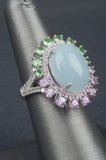 Oval Aquamarine Ring With Tsavorite, Pink Sapphire and White Zircon Border